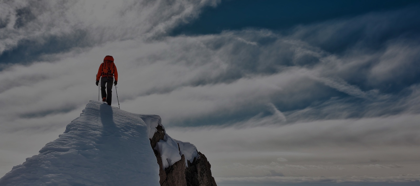 Walking along a snow-covered mountain ridge