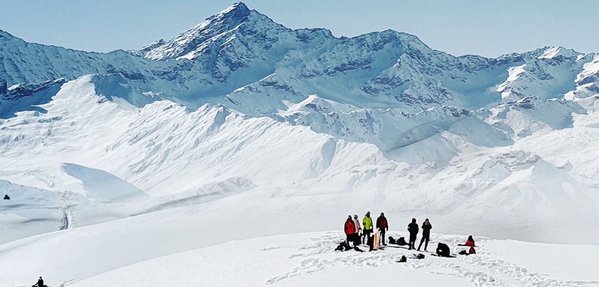 A group of hikers on a snowy slope